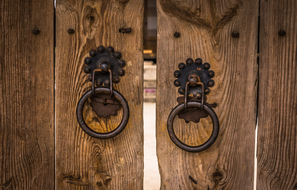 brown wooden closed gates with metal handles